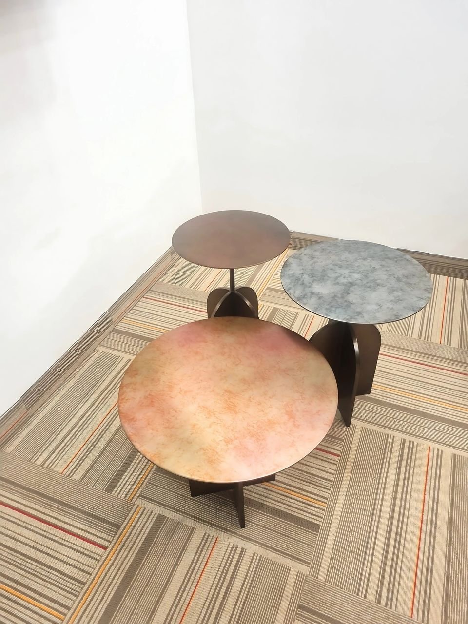 Nesting centre tables with patinated tops