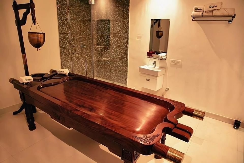 Therapy room with a carved timber massage table