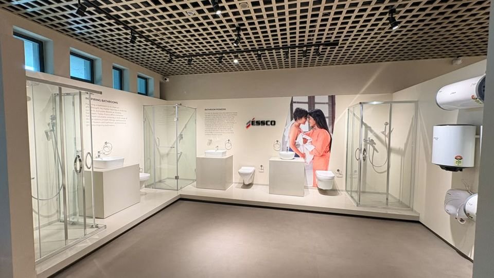 Essco bathroom range. Essco shower enclosures, sanitaryware and water heaters set out as complete bathroom bays.