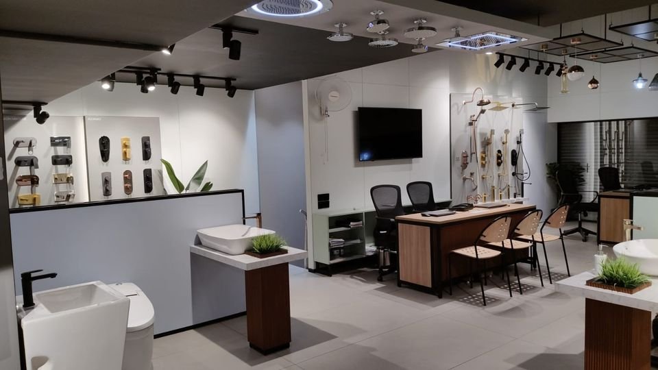 Bath fittings displays, basin plinth and a consultation desk
