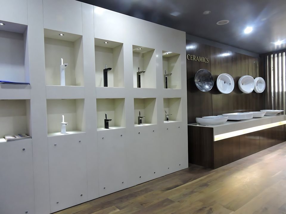 Lit display niches for faucets beside a basin counter