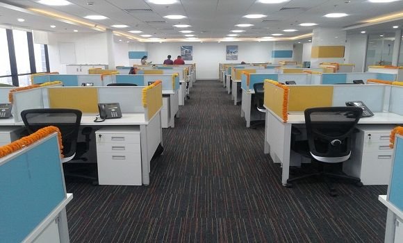 Open-plan workstations with coloured screens
